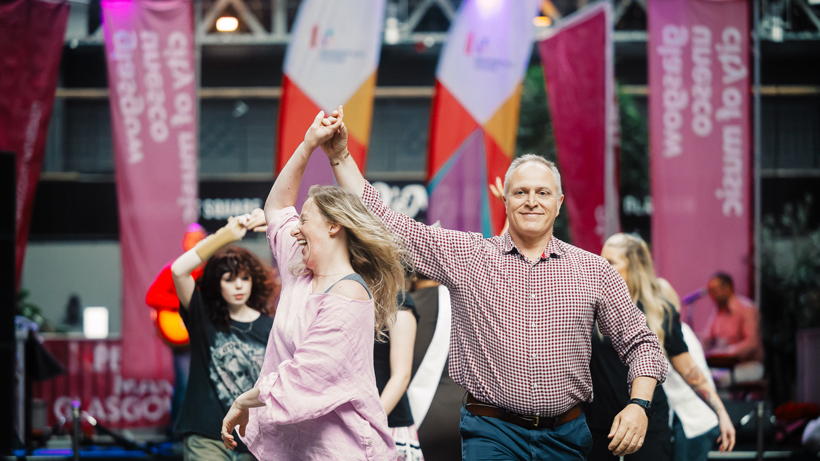 A couple dancing at a ceilidh during the Merchant City Festival.