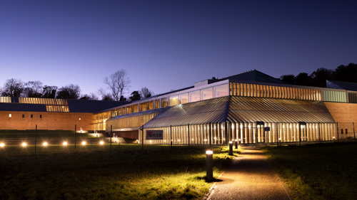 Image of the Burrell Collection lit up at night time