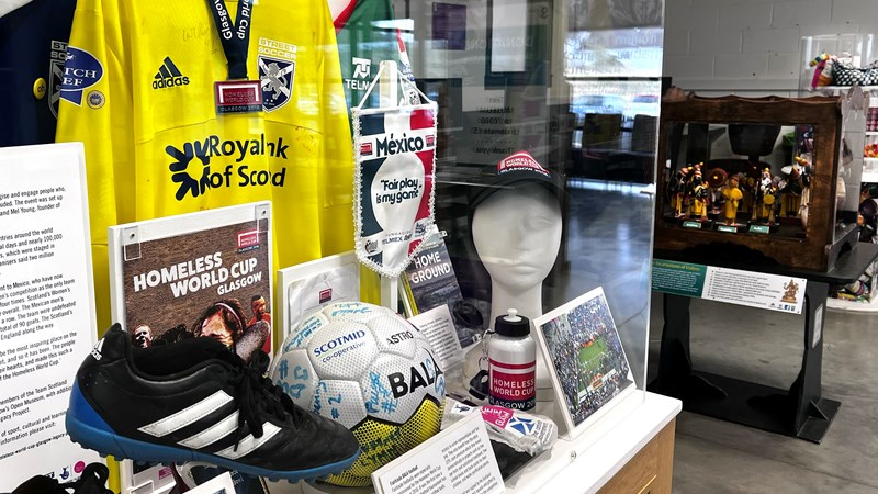 Photograph shows a display featuring football nostalgia.